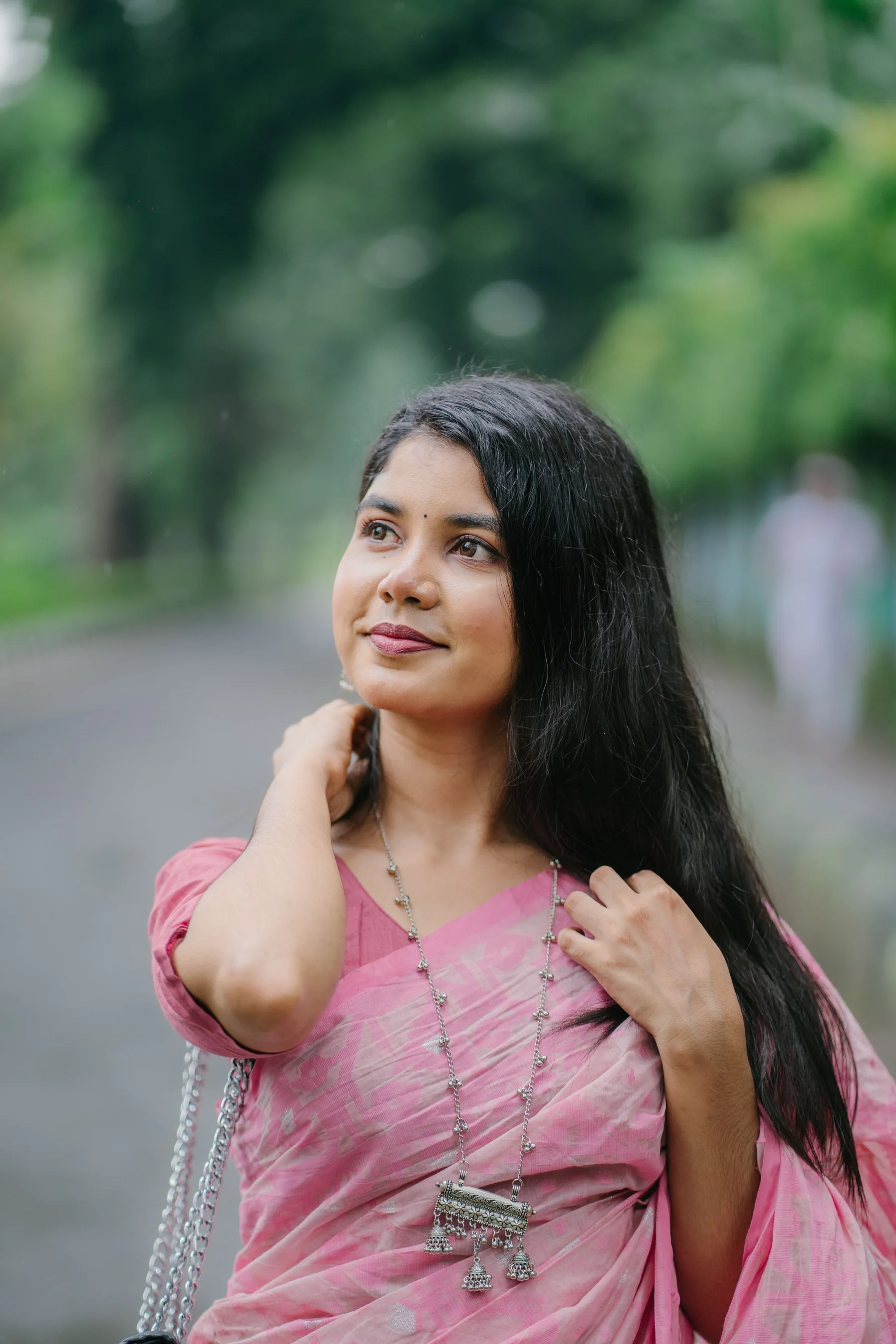 Woman in a refined pink ethnic saree look