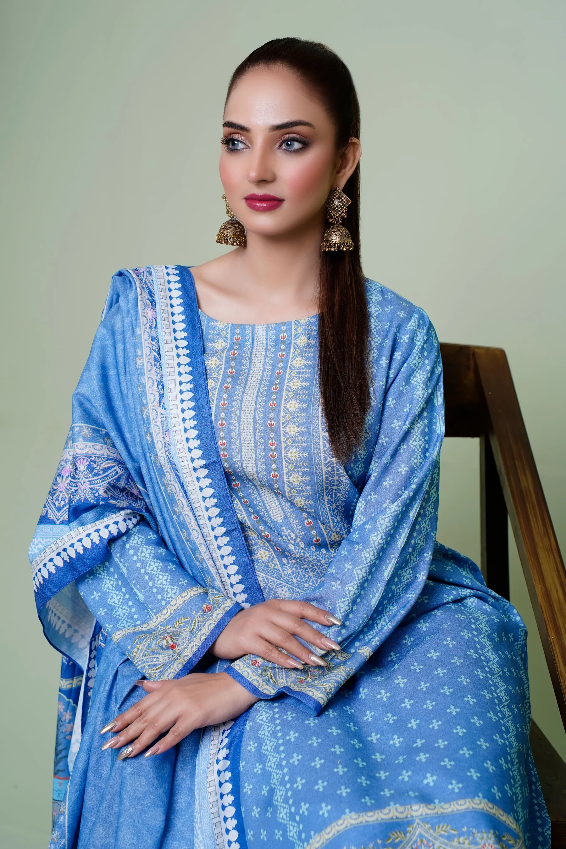 Woman modelling a premium blue printed kurti set