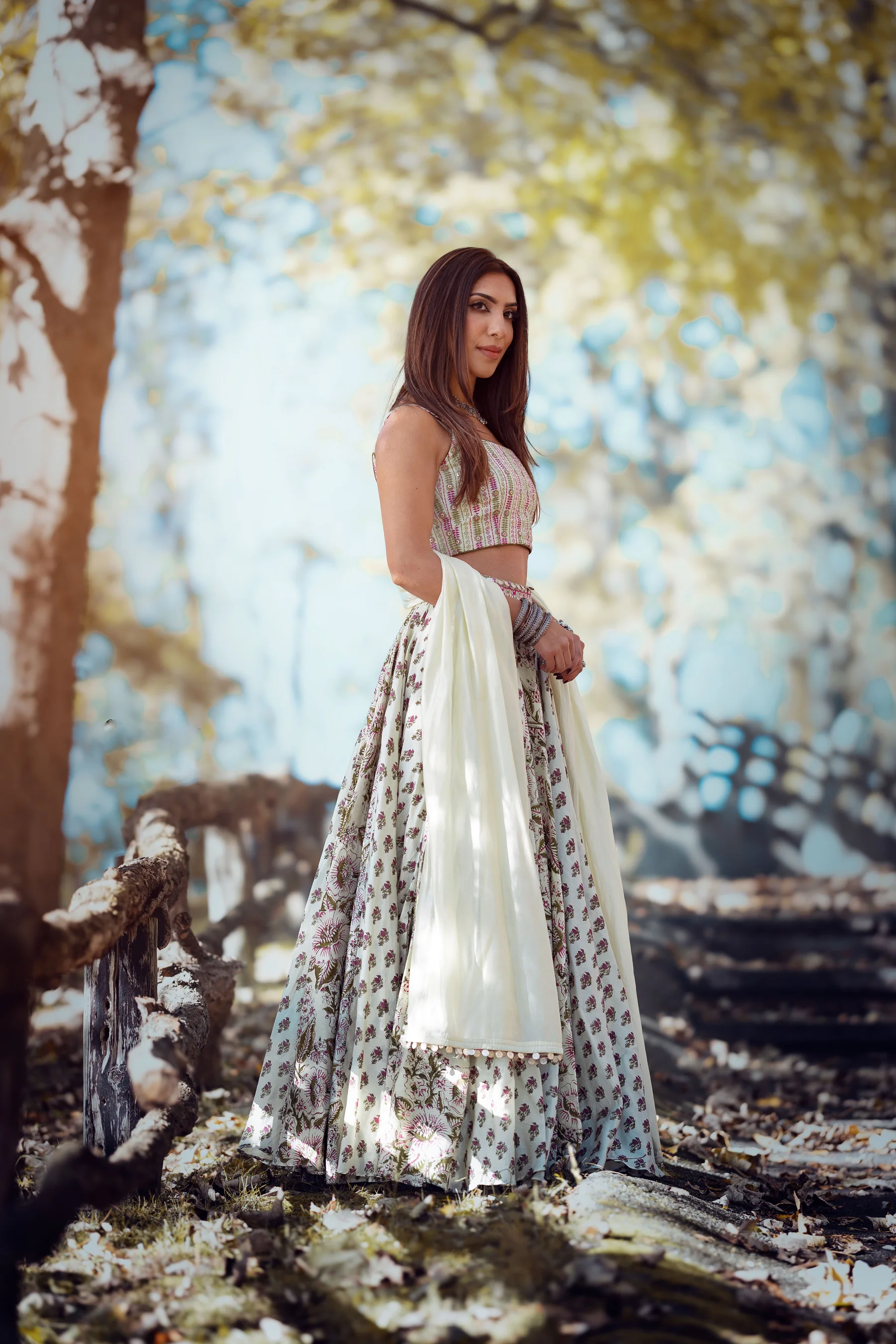 Woman wearing a graceful floral lehenga outdoors